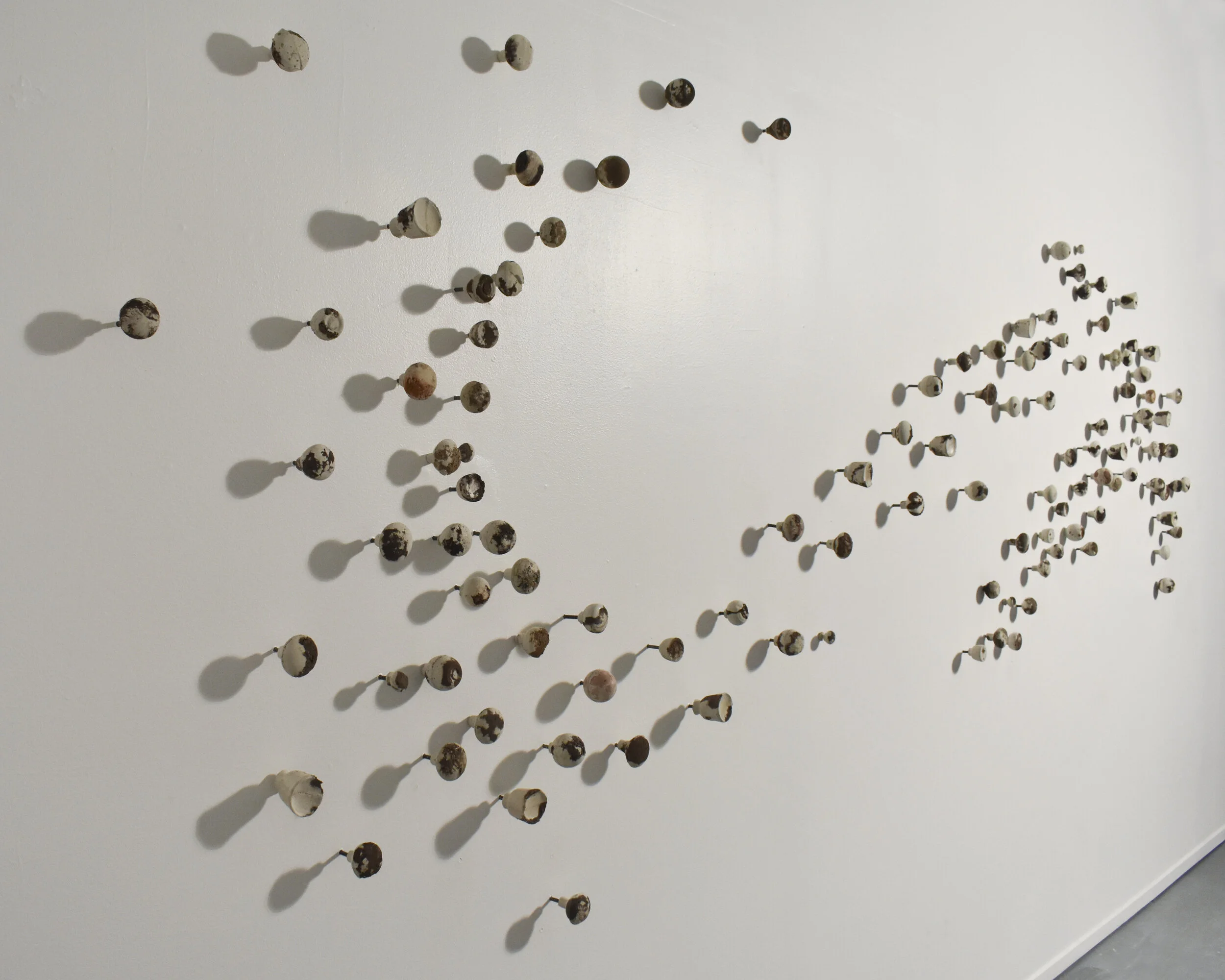 A Place Called Home, Soil collected from 117 San Diego residents cast into individual concrete door knobs, 18’ x 9’ x 4”