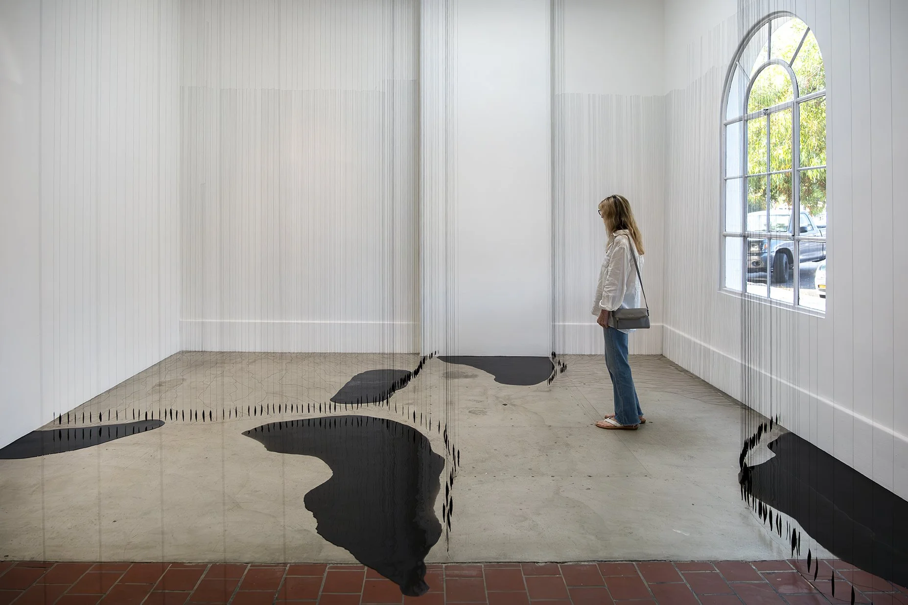 With this installation, the viewer is invited to spend time in the space and notice the subtle interventions with the architecture. (Photo credit: Pablo Mason)