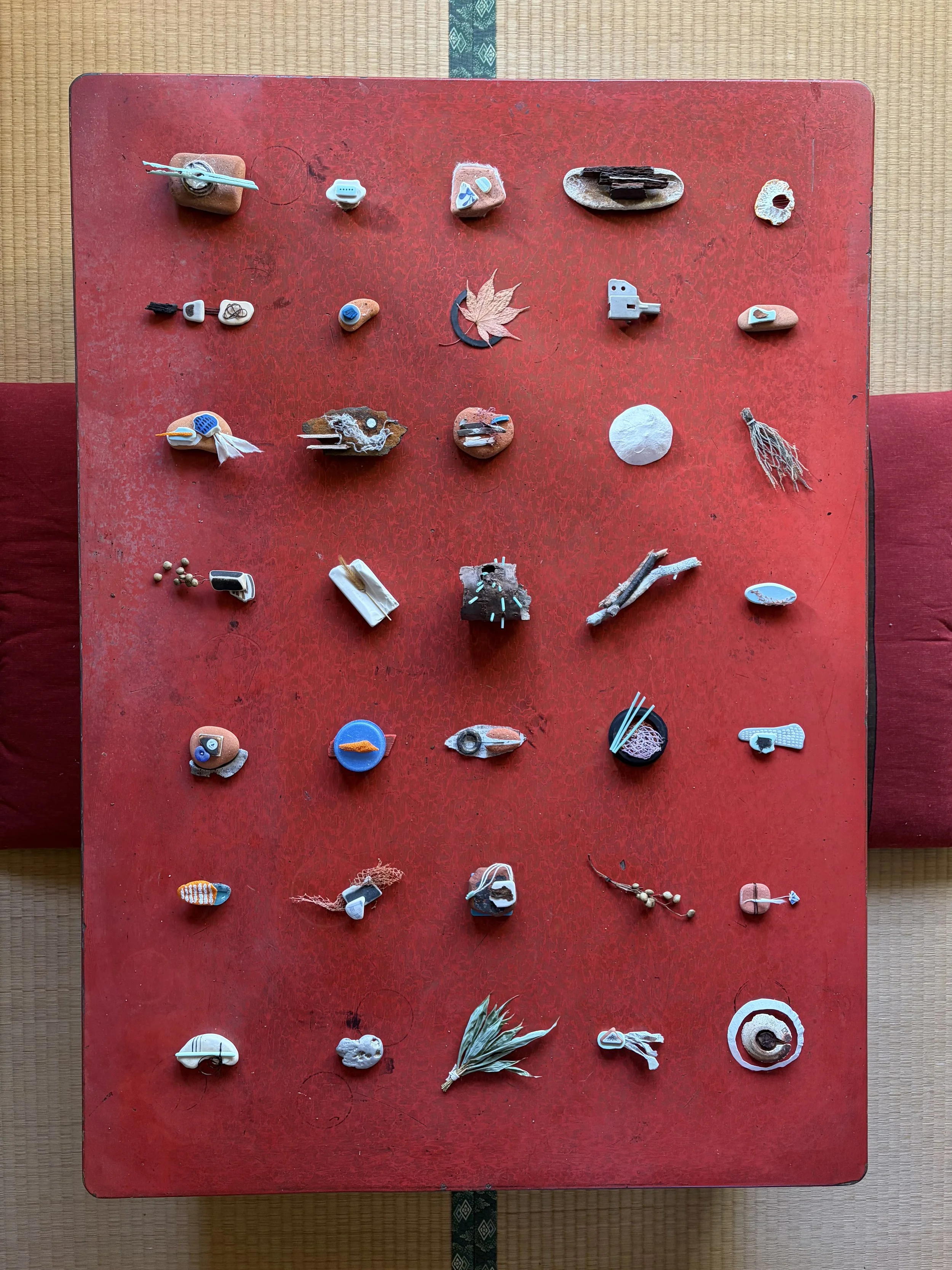 Found objects along Japan’s coastline, paper, twine, and thread