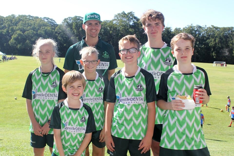 Nambour Wildcats Soccer Club president Ronnie McKenzie with players .jpg