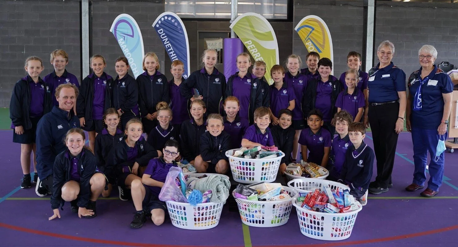 Talk about Good Samaritans! College  presents baskets of kindness to Vinnies