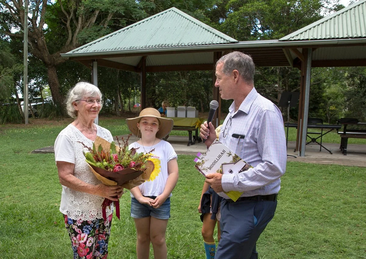 Author Eunice Paulett is presented with a bouquet by children and Ted Hungerford, Councillor Division 7 Photo Marion Jonkers