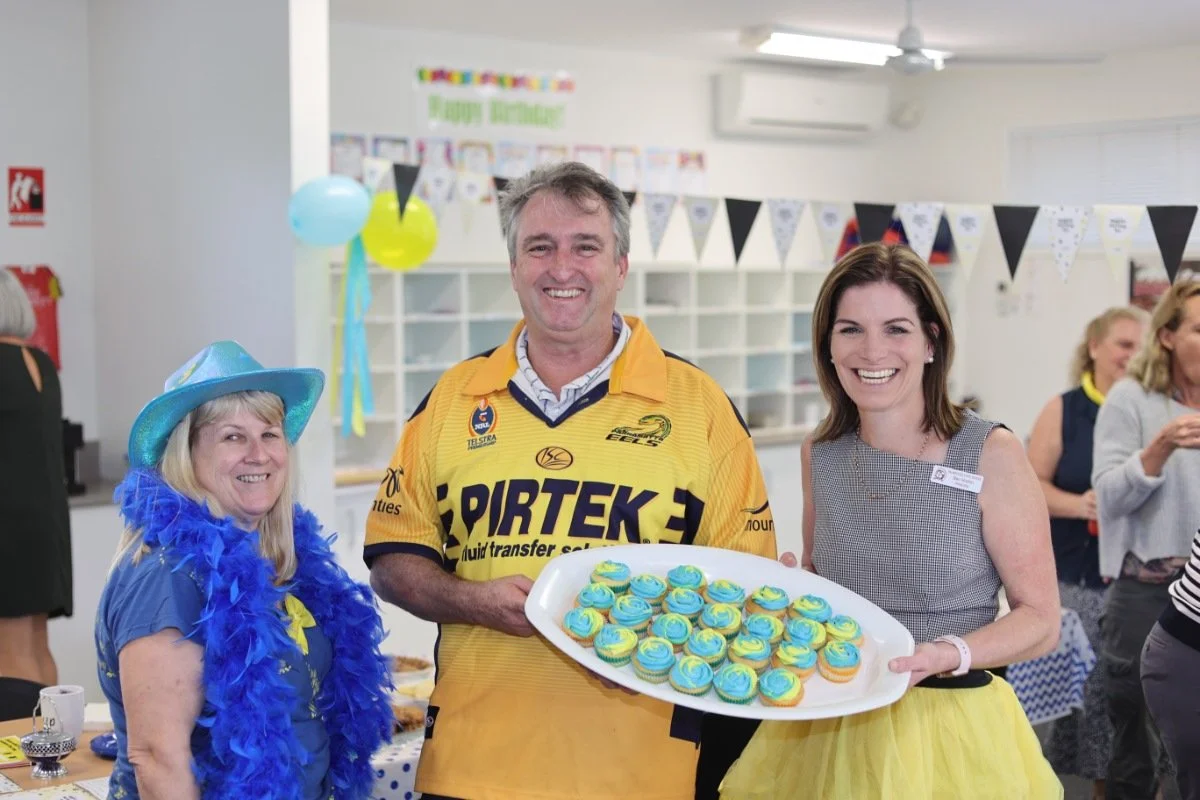 Claudi Garret, Craig Wockner and Principal Rebecca Hutton donned blue and yellow for the great cause.