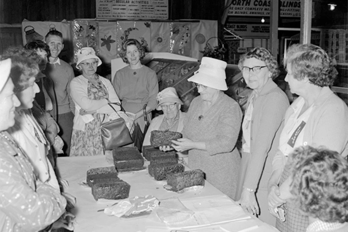 Judging Fruit cake entries, 1964. 