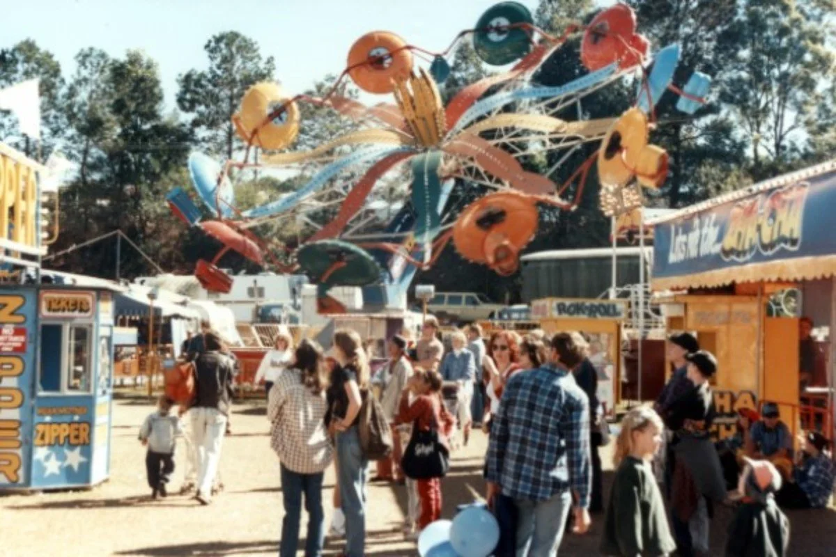 Side Show Alley and rides at the annual Sunshine Coast Show, Nambour, 1970s. 
