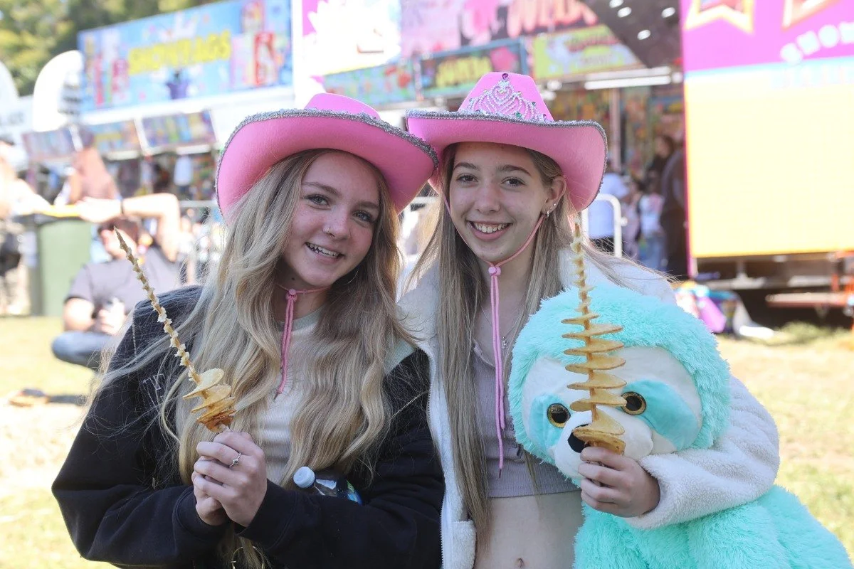 Ninni Phillips and Elizabeth Hunter enjoy their potato slinkys.