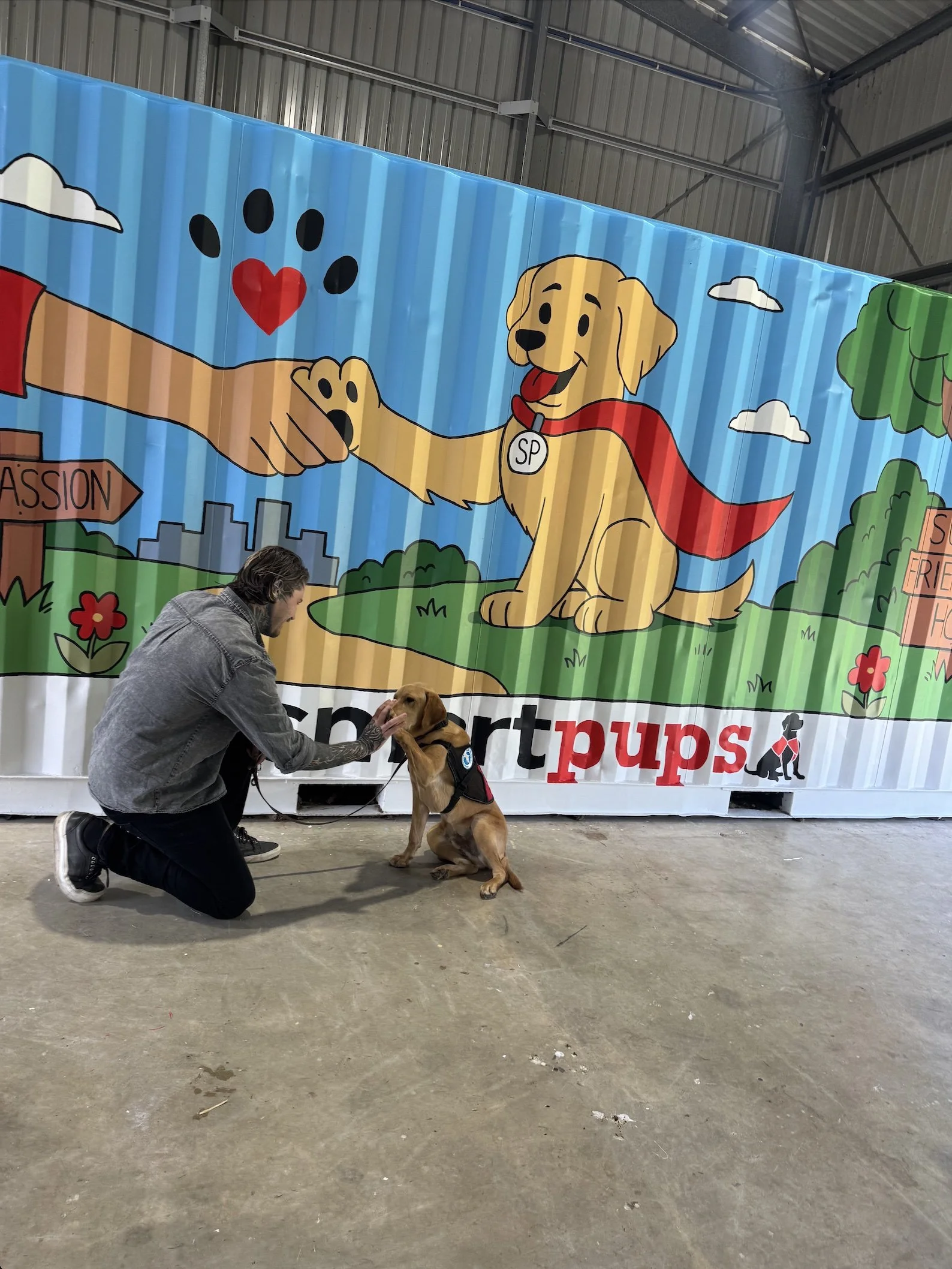 Local artist brings Smart Pups headquarters to life with colourful community mural