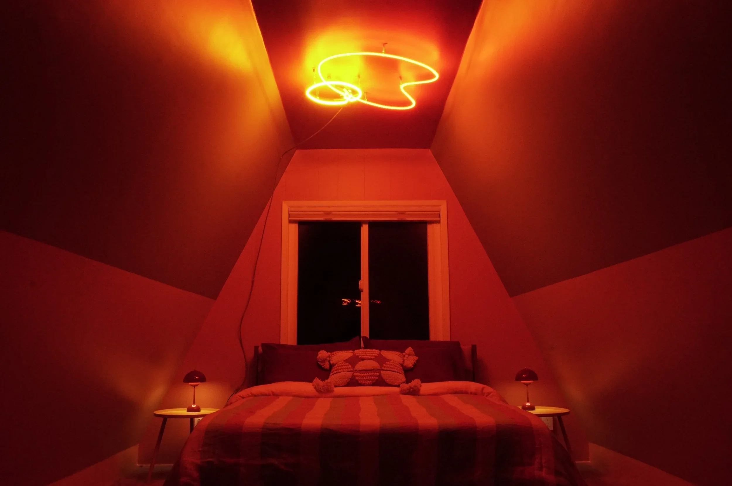 Ames made the neon for "Cabin Magic" designed and installed by Artist Laura Stevenson