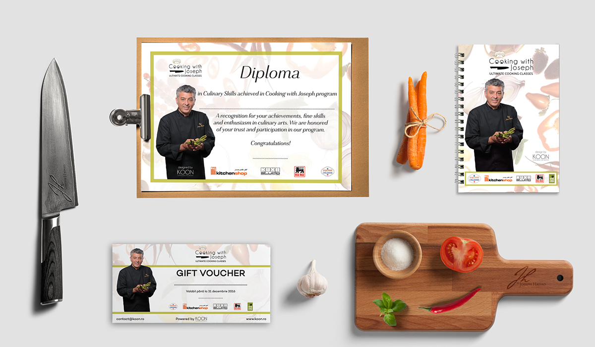 Cooking with Joseph certificate of achievement, a knife, a pad of paper, carrots, a garlic bulb, a tomato, a chili pepper, a salt bowl, a basil leaf, a gift voucher, and a recipe book on a white background.