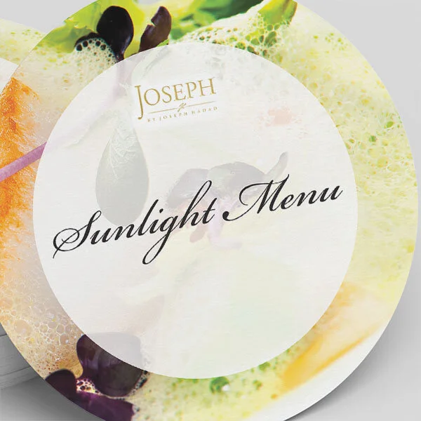A menu titled 'Sunlight Menu' with the brand 'Joseph' at the top, featuring a colorful background of fruits and vegetables.