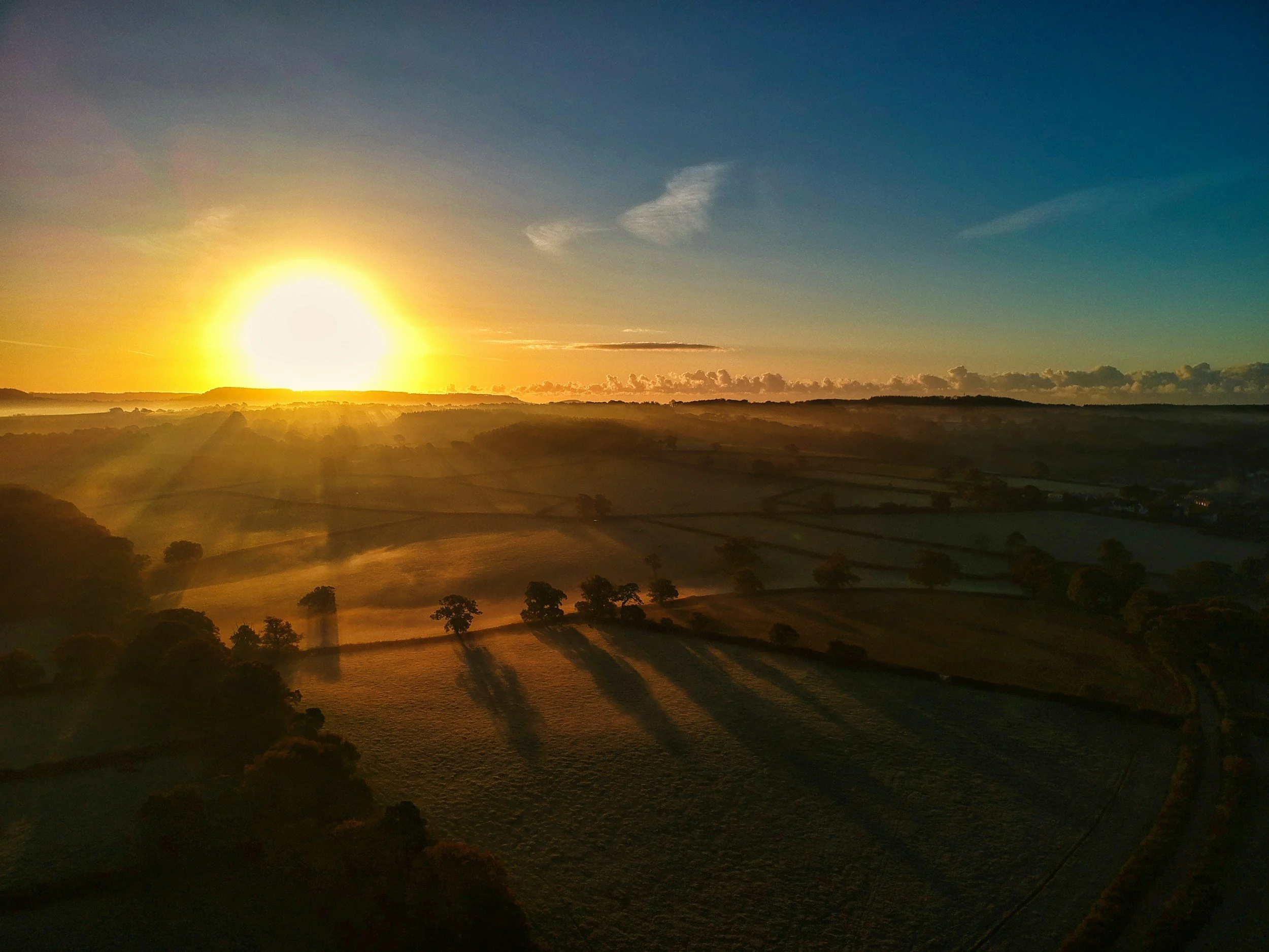 Sunrise over the horizon representing hope and a new beginning for marriage after infidelity recovery and betrayal trauma