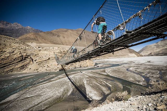 Suspension bridges link many Himalayan valleys and mountain passes together. Here is our favorite one that crosses the mighty Kali Gandaki River near Kagbeni. 📸: Dan Milner

#nepal #himalayas #mtb #mountainbike #adventure #photography #himalayanride