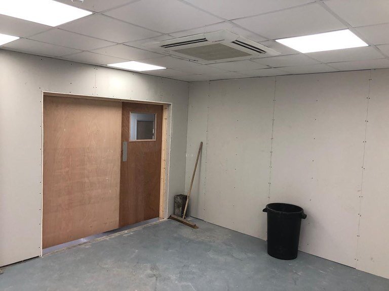 New opening cut in wall and metal stud partition installed. 1200mm wide ply door installed next to standard vision panel door to allow for large machinery to be relocated in the future. Completed on a Saturday to avoid disruption to the client 

#sus