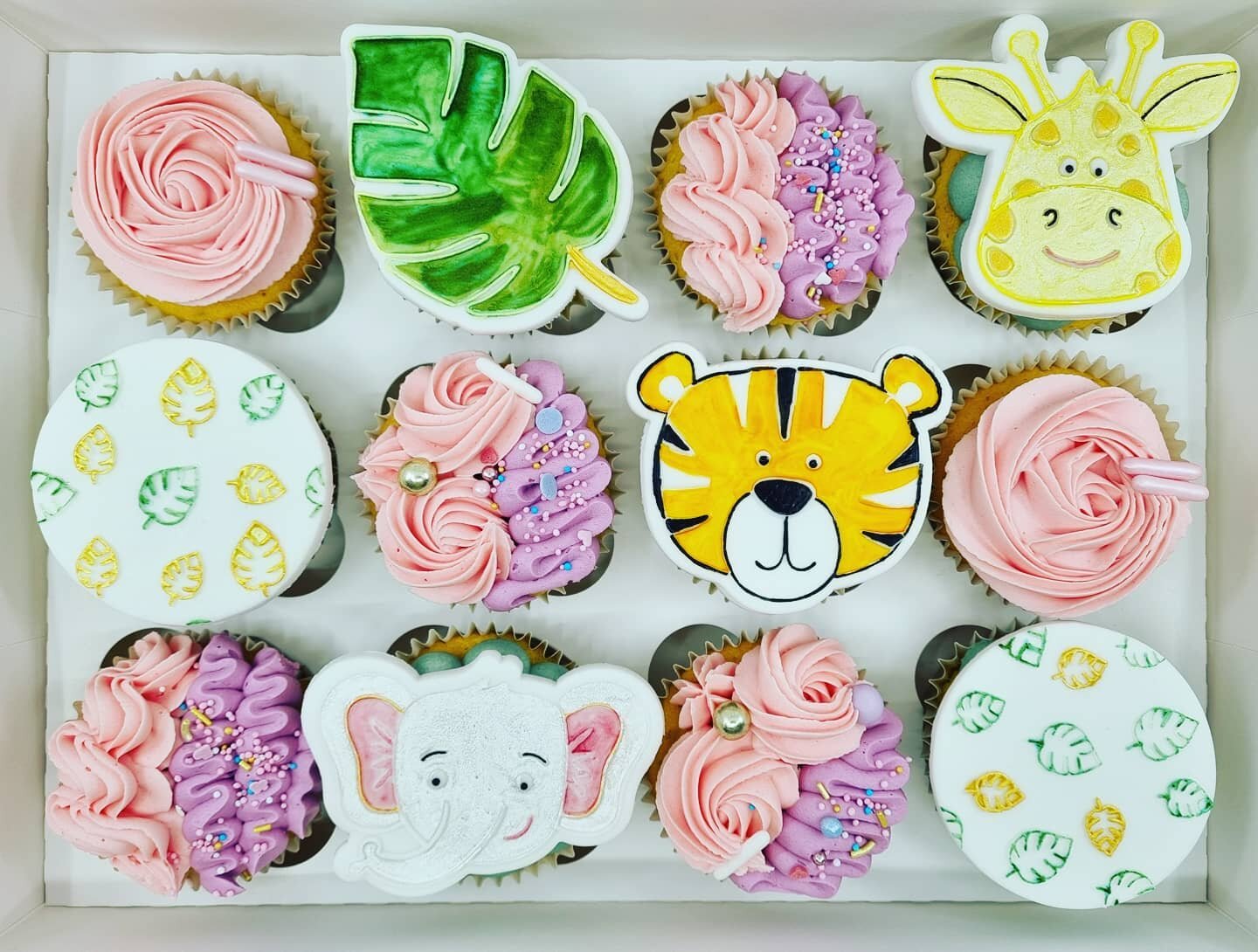 Cupcakes for a little girl who loves animals, pink and purple