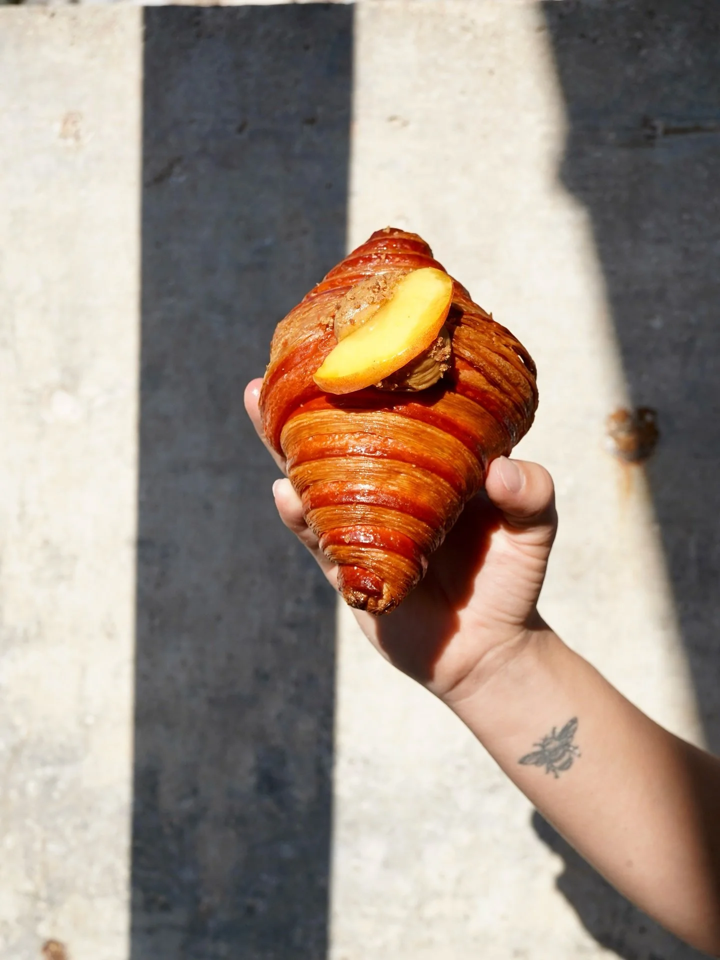 Our new Peach Cobbler Croissant takes Palisade peaches to another dimension with peach jam, fresh peaches and cookie butter English cream! Stop by soon, this beauty is here for a limited time!