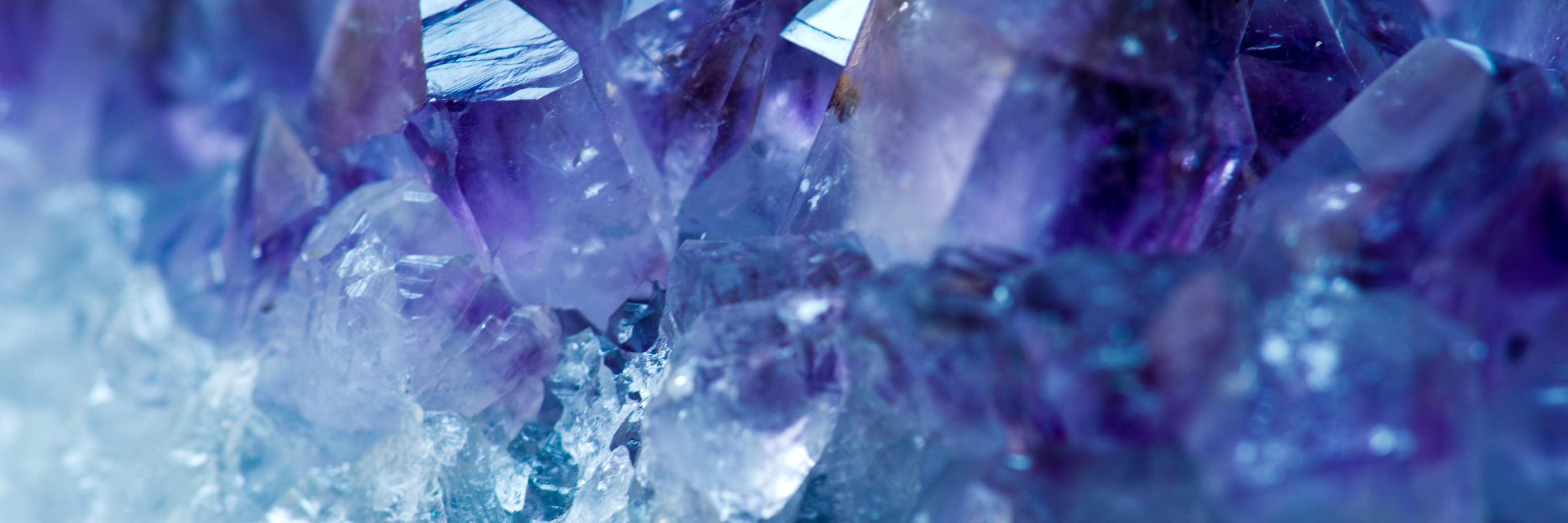 Close up image of a purple and blue crystal growing