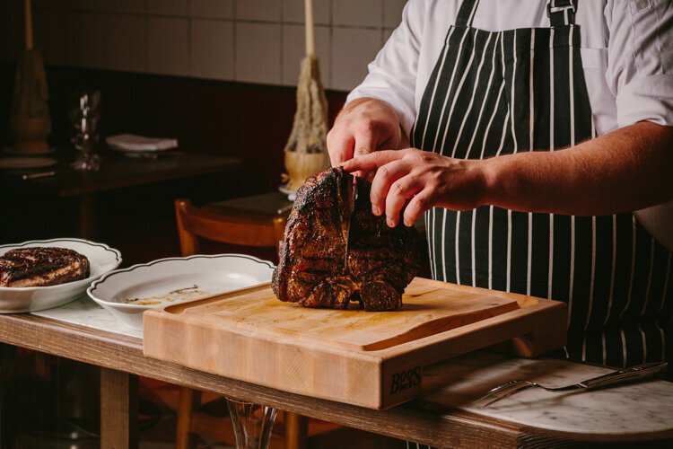 associazione-chianti-italian-steakhouse-chef-cutting-steak.jpg