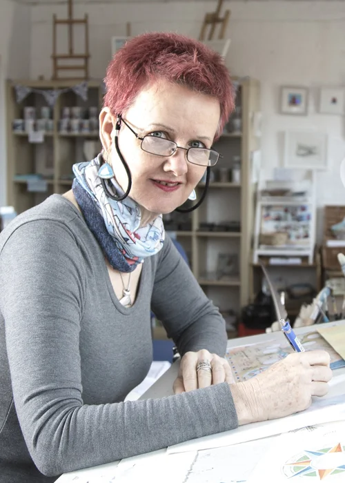 Claudia Myatt working at her desk
