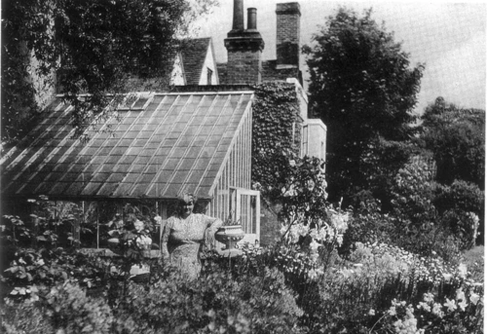An old photograph of Margery Allingham in a garden