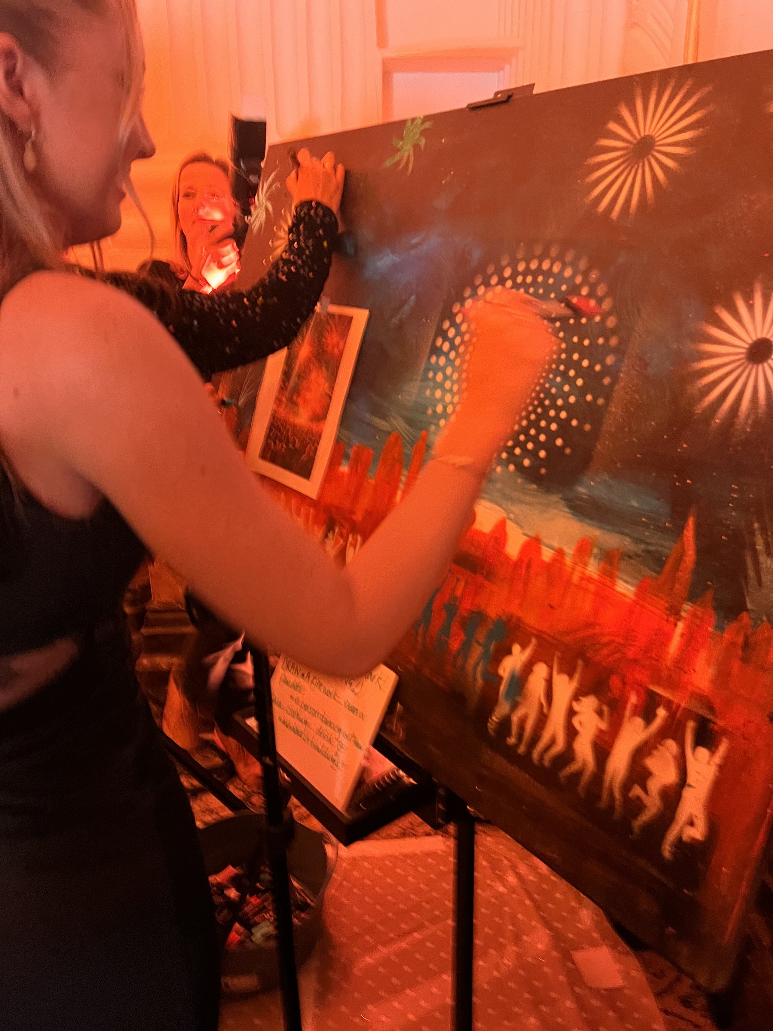 corporate art ,party, gala showcase  guest join in collaborative art work 