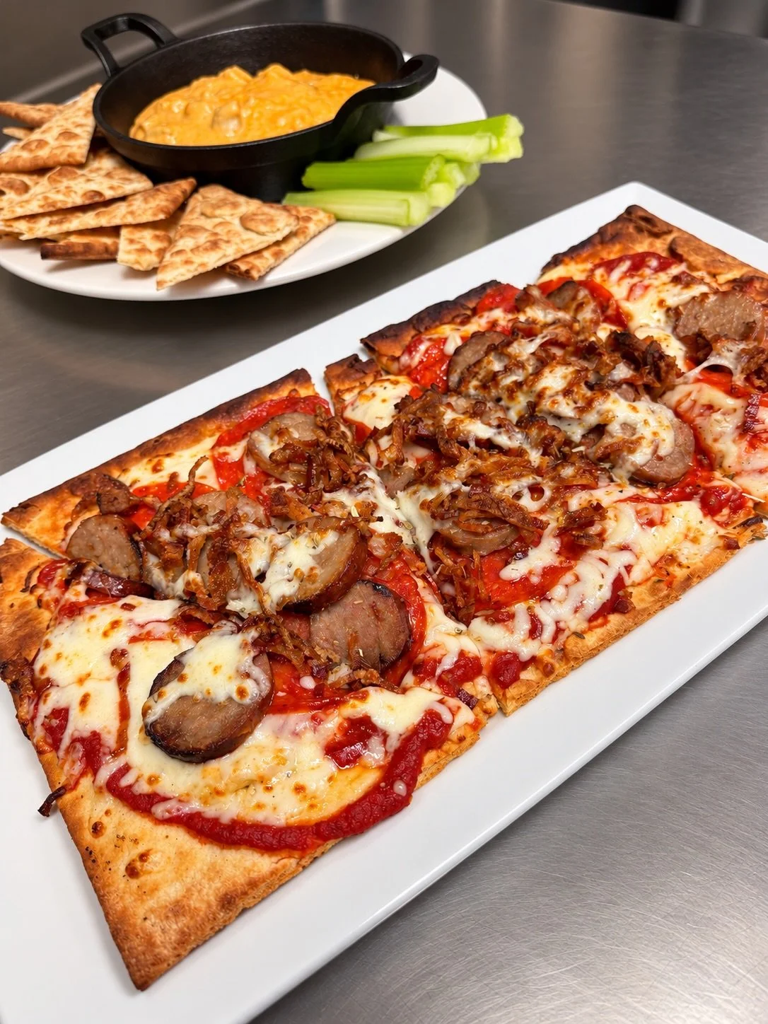 Brisket grilled cheese, buffalo chicken dip &amp; meat-loaded carne flatbread. Give your kitchen the weekend off. #GetToTheTavern
