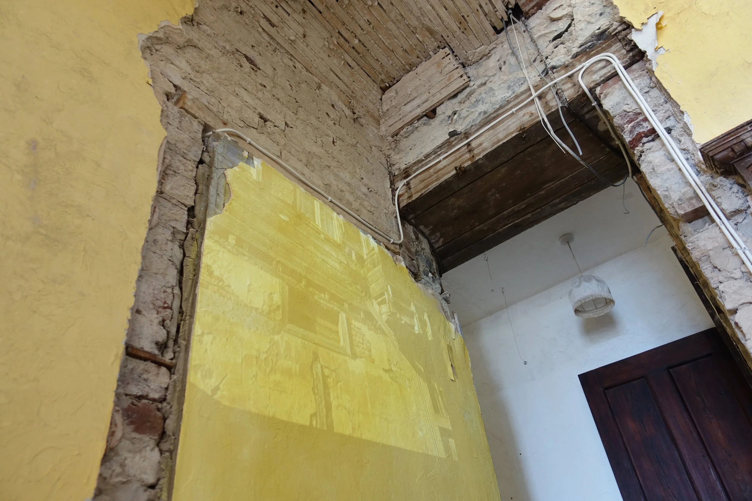 Walls, like skin, have layers. The smooth rendered outer surface doned in aspirational colours. Resilient, up to a point. Its underneath we find nerves, bones, muscle. Form following function and function following form, joined in utility. Delineate