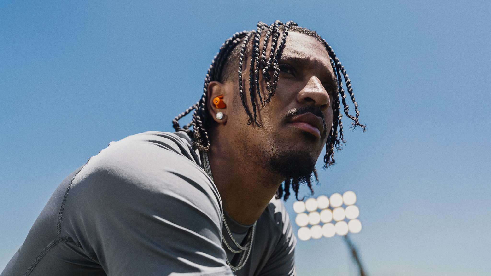 TSIYE_JAYDEN DANIELS_POWERBEATS FIT_494B_SPARK ORANGE_0980_G1_RGB_16x9.png