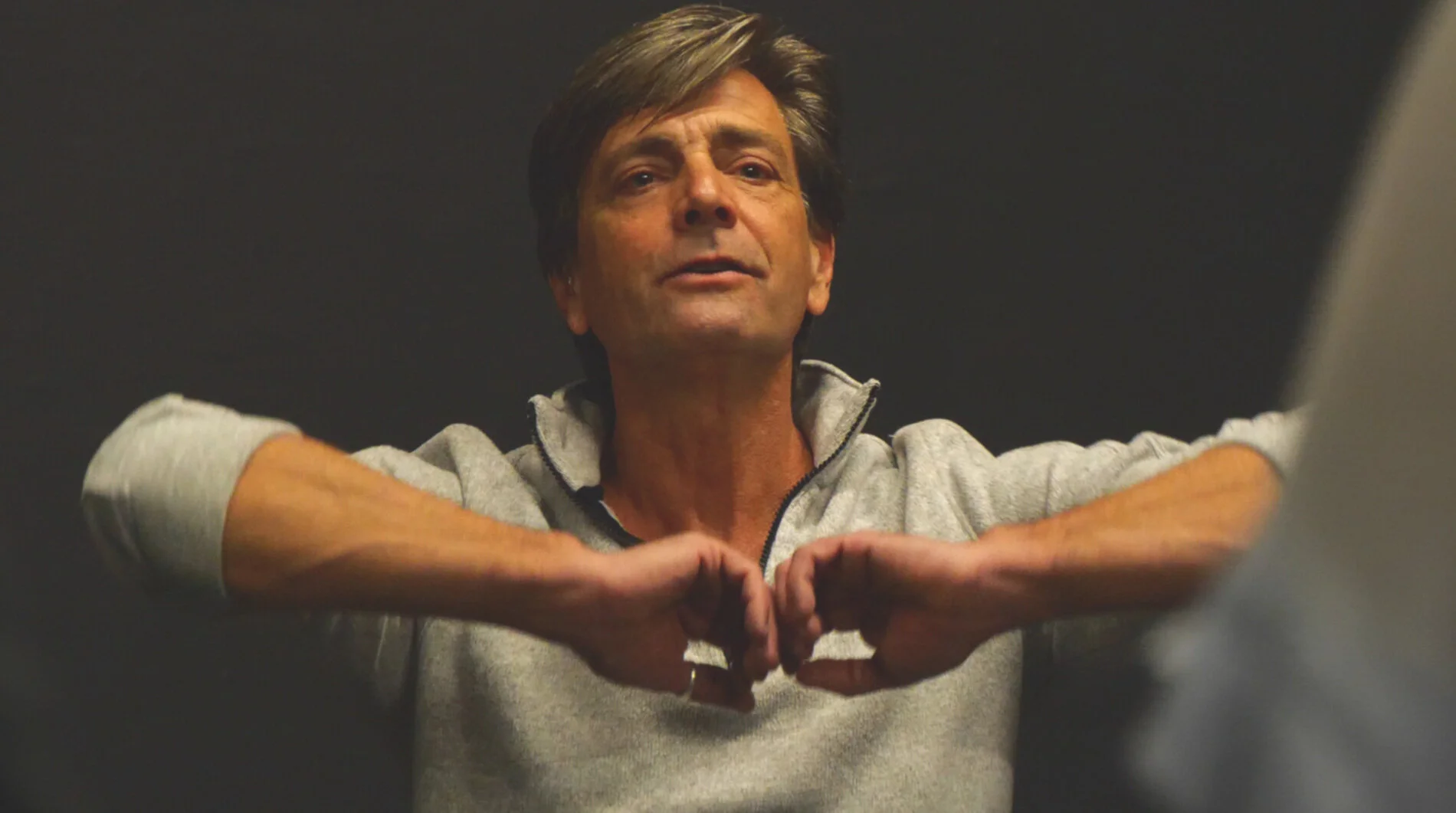 Jeff+Crockett+Teaching.++Arms+gently+raised%2C+elbows+bent%2C+backs+of+fingers+on+each+hand+lightly+touching+eachother+in+front+of+him.++.jpg