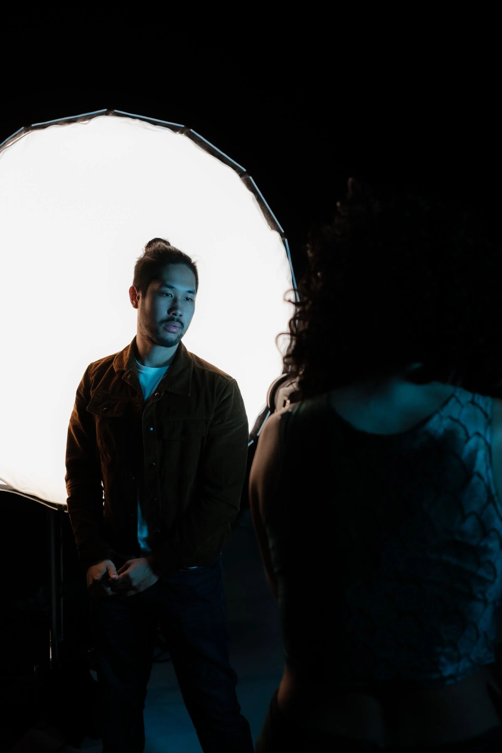 On-site corporate photographer shooting a portrait session with studio lighting