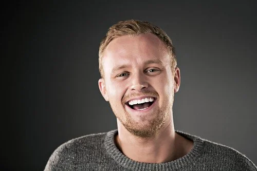 Portrait of a laughing man with a genuine, natural smile