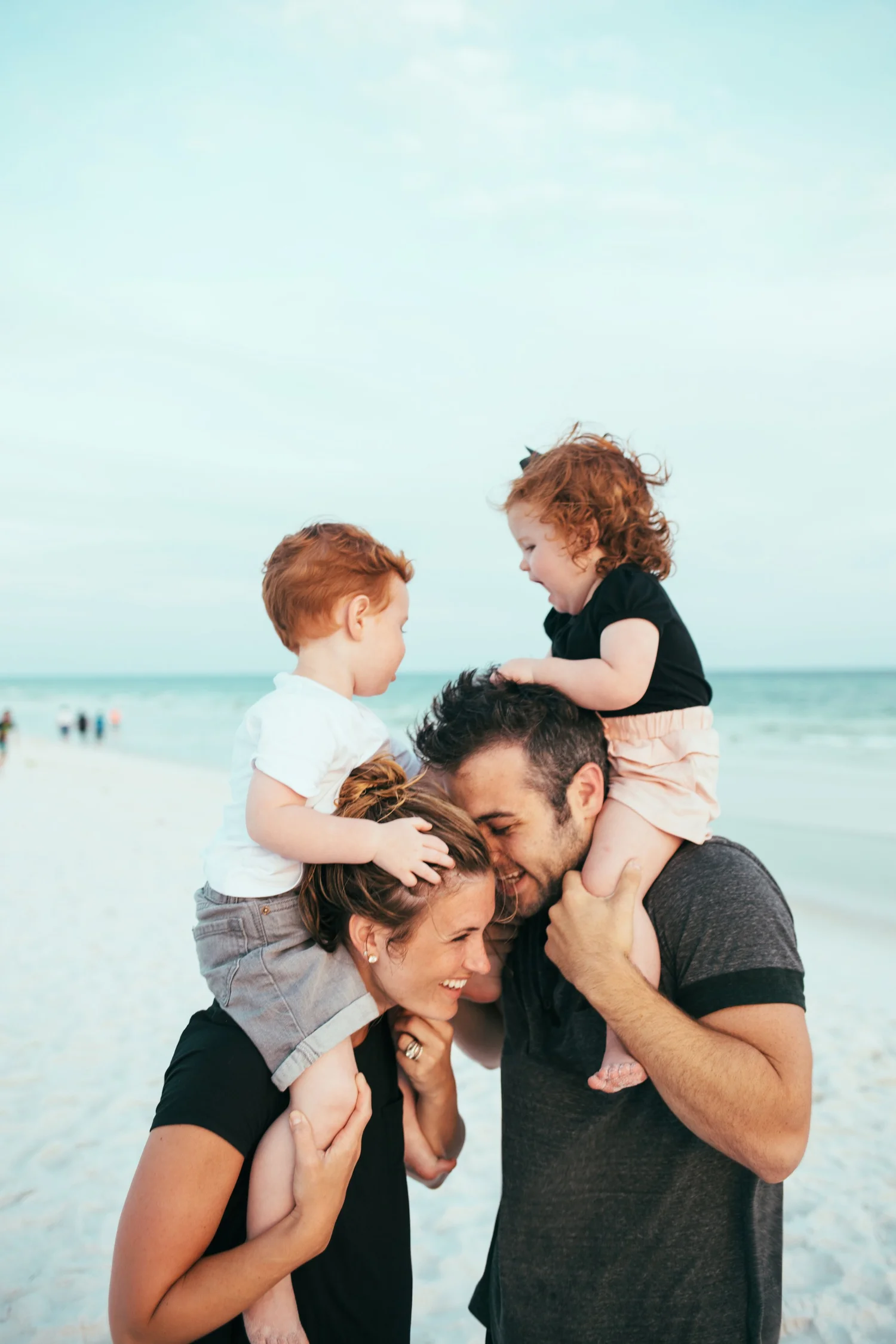Warm family portrait in soft holiday light, the style of image a Christmas mini session delivers