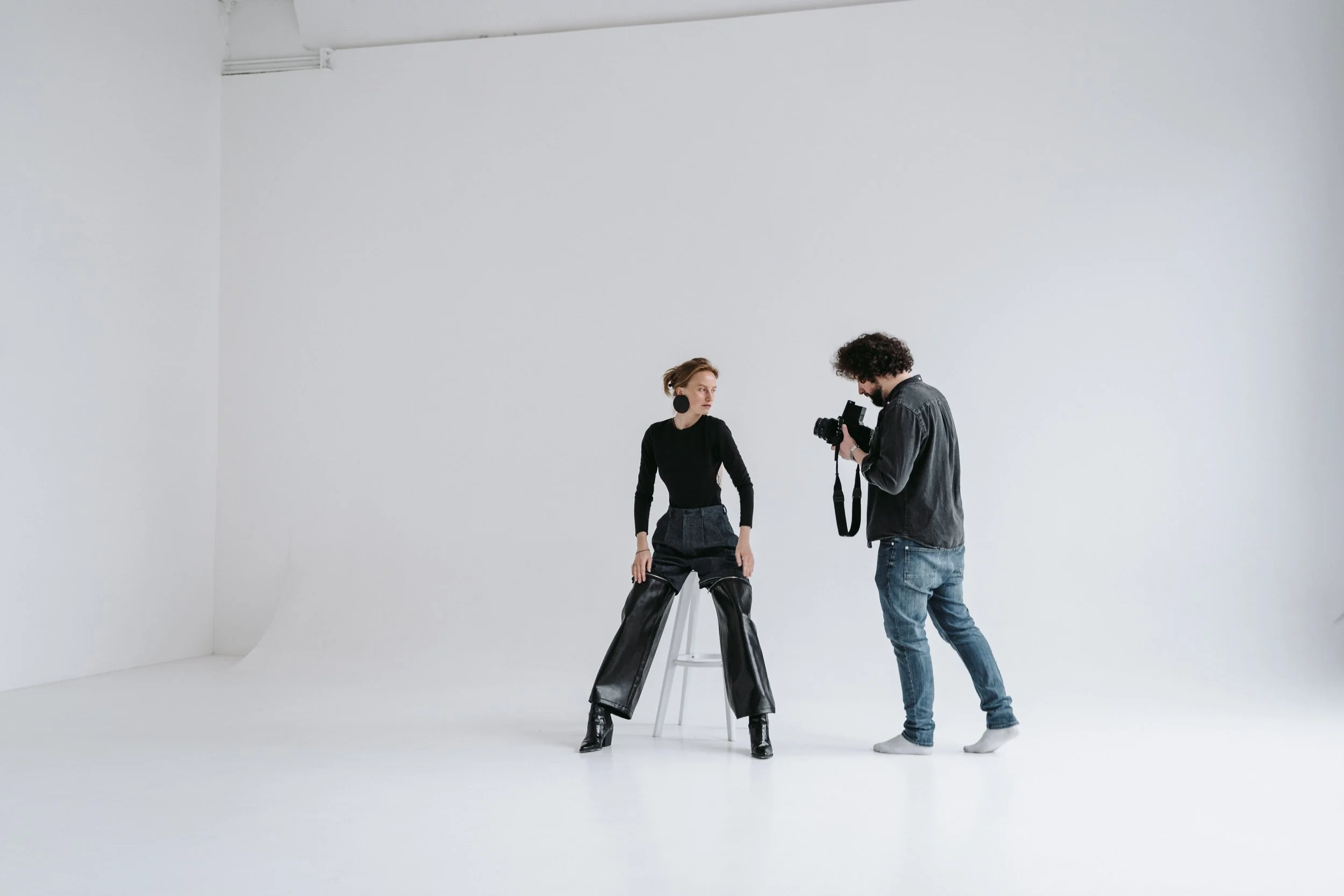 Female headshot photographer directing a woman during a studio headshot session in Los Angeles
