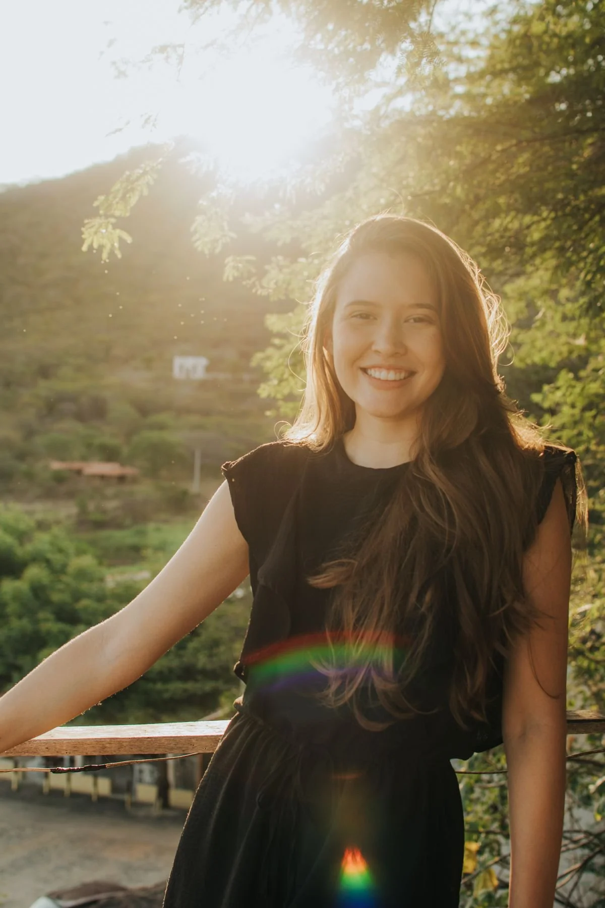 Woman smiling in golden hour light outdoors, a natural lifestyle photo for a Los Angeles dating profile