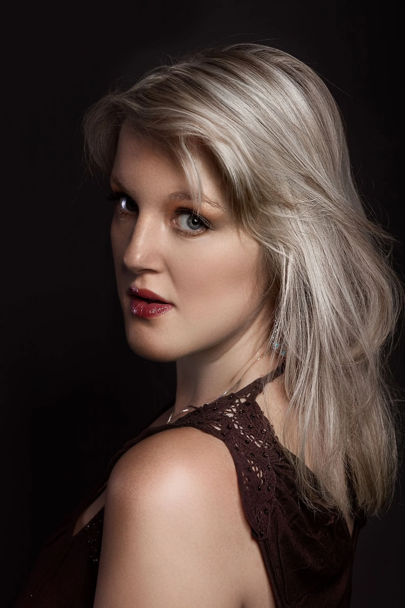 Close-up beauty portrait with sculpted studio lighting and soft shadows from a beauty dish lighting setup