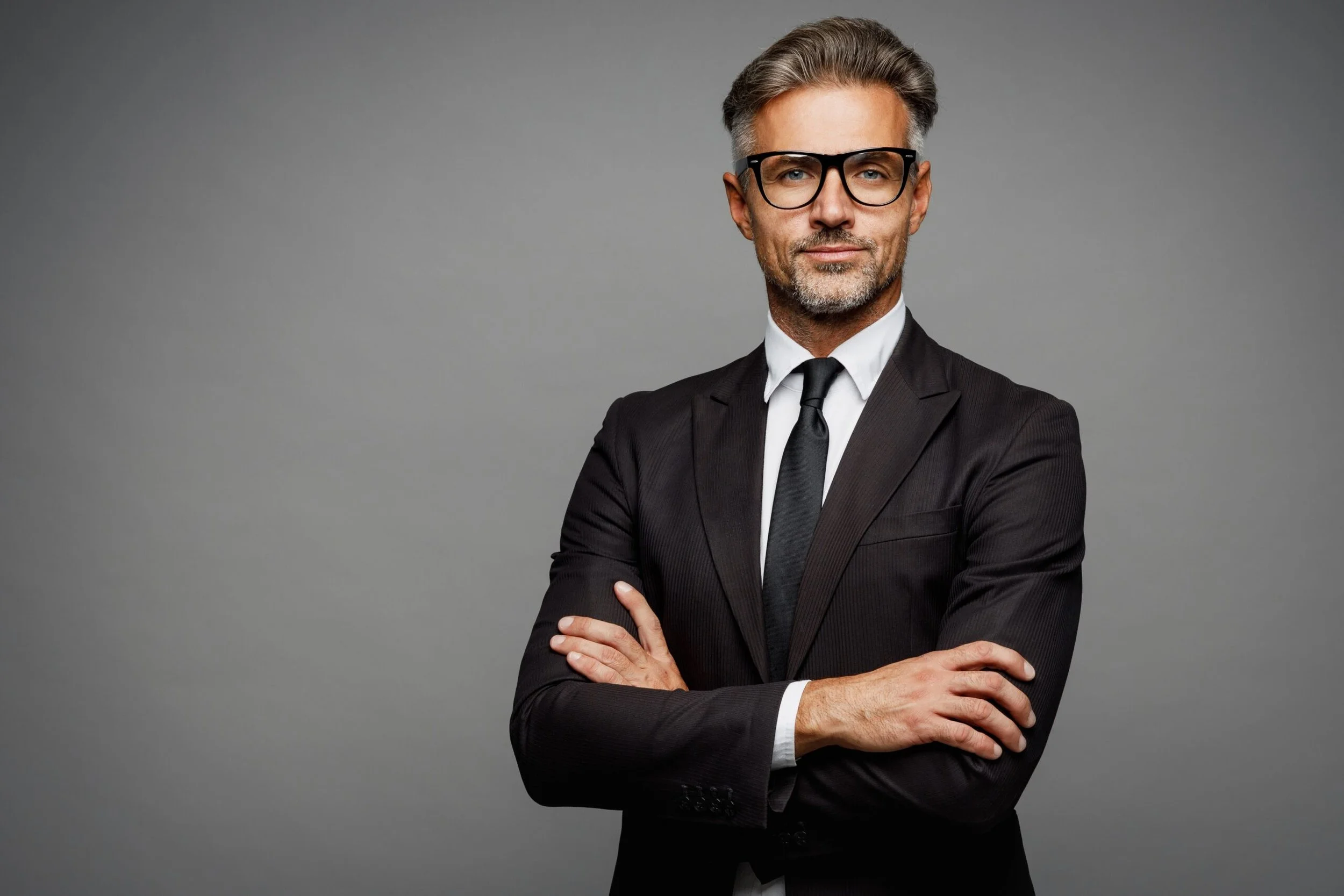 Photographer comparing studio backdrop options for headshot sessions