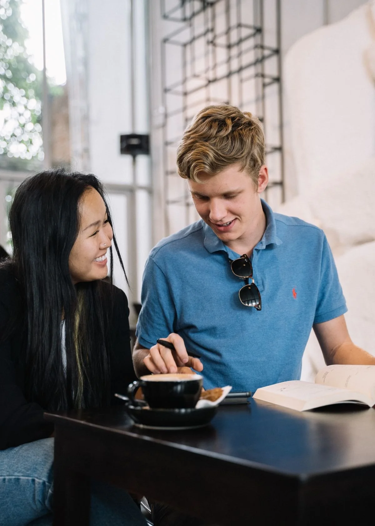 Couple enjoying a coffee date at a cafe, the kind of genuine lifestyle moment that works on a dating profile