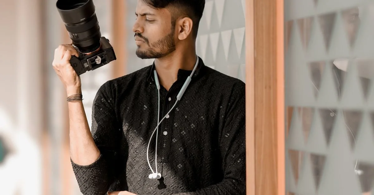 Professional photographer holding camera at a corporate event