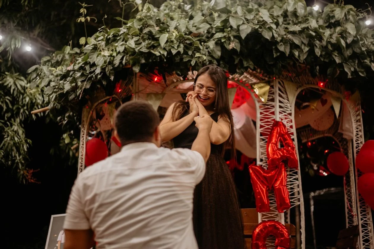 Proposal photographer capturing a styled gazebo proposal with lights in Los Angeles