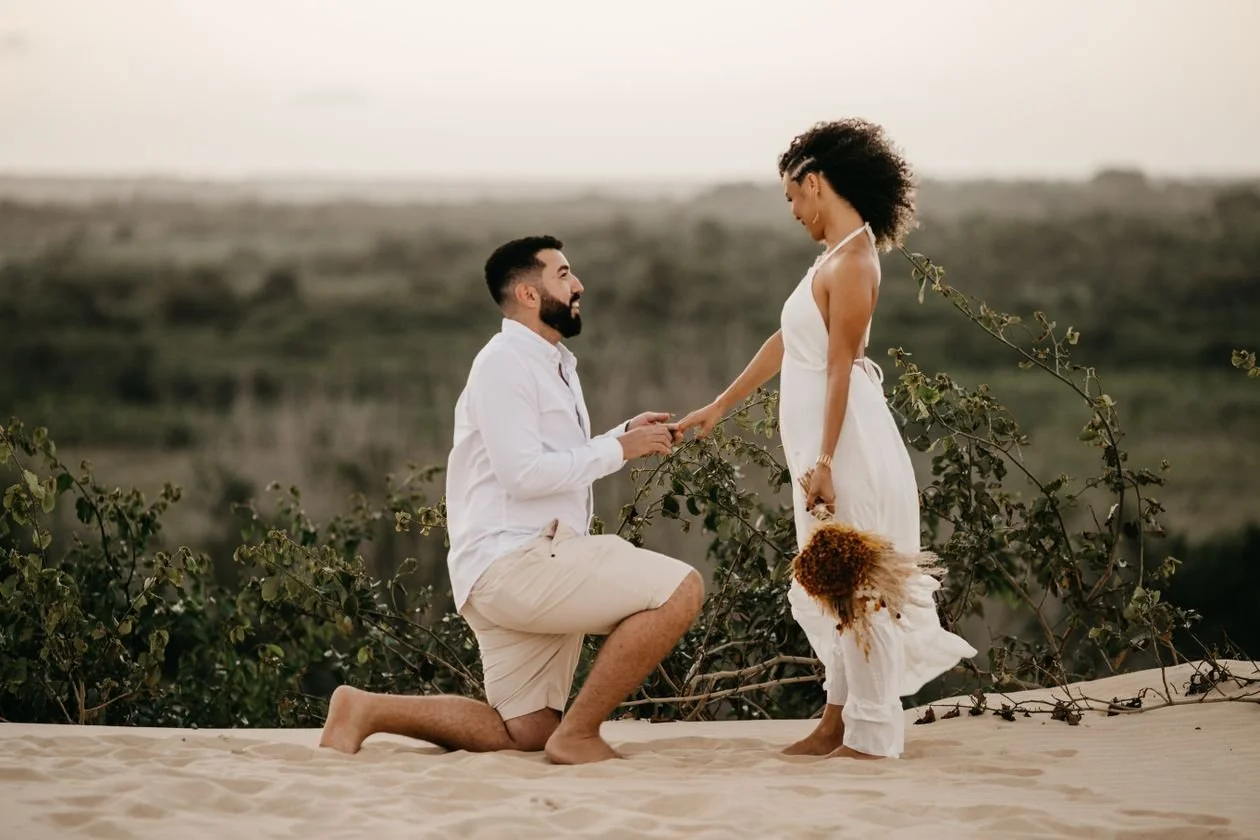 Surprise proposal photographer in Los Angeles shooting a beach proposal at sunset