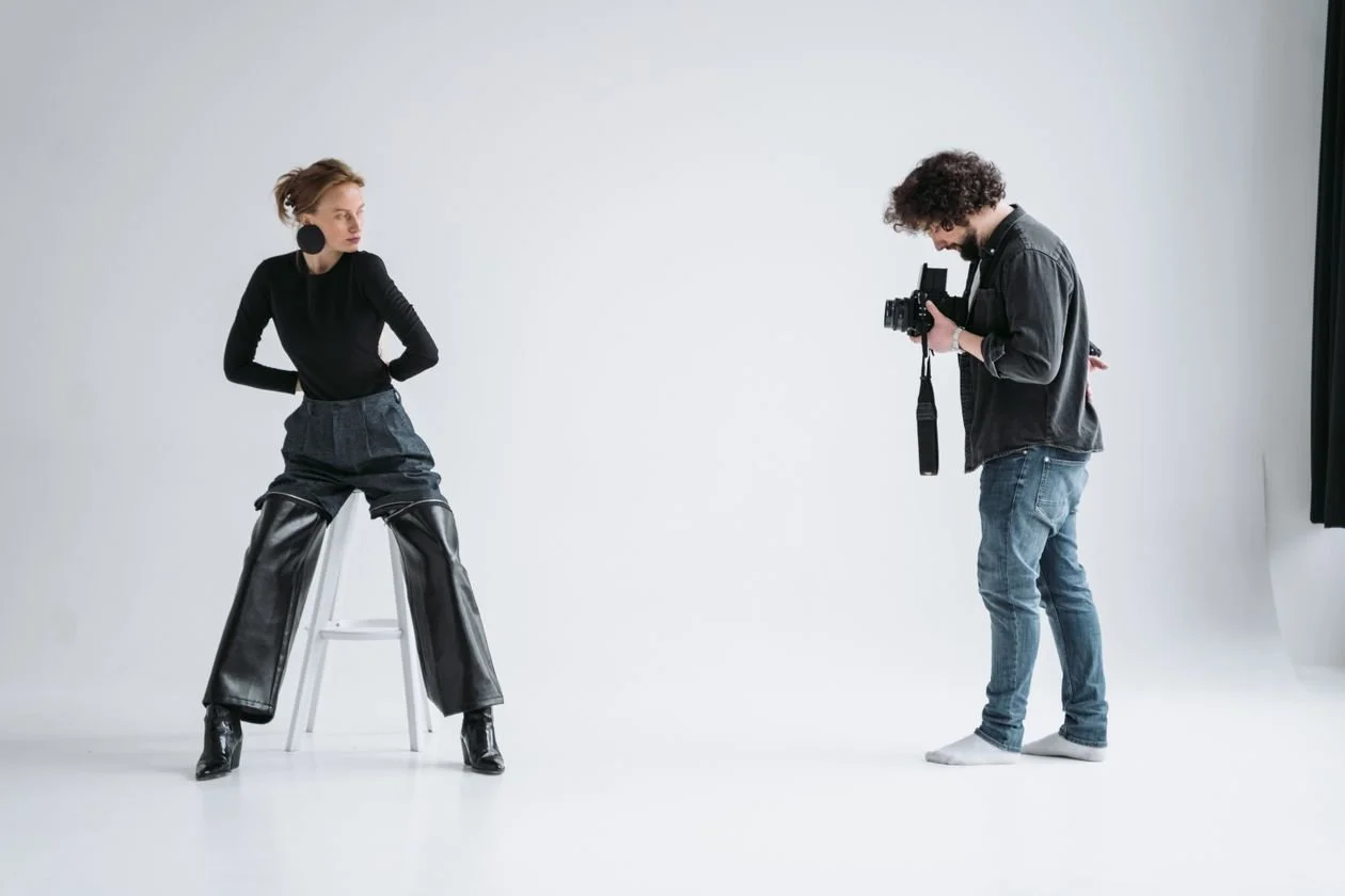 Model posing on a stool during a Los Angeles fashion photography studio session