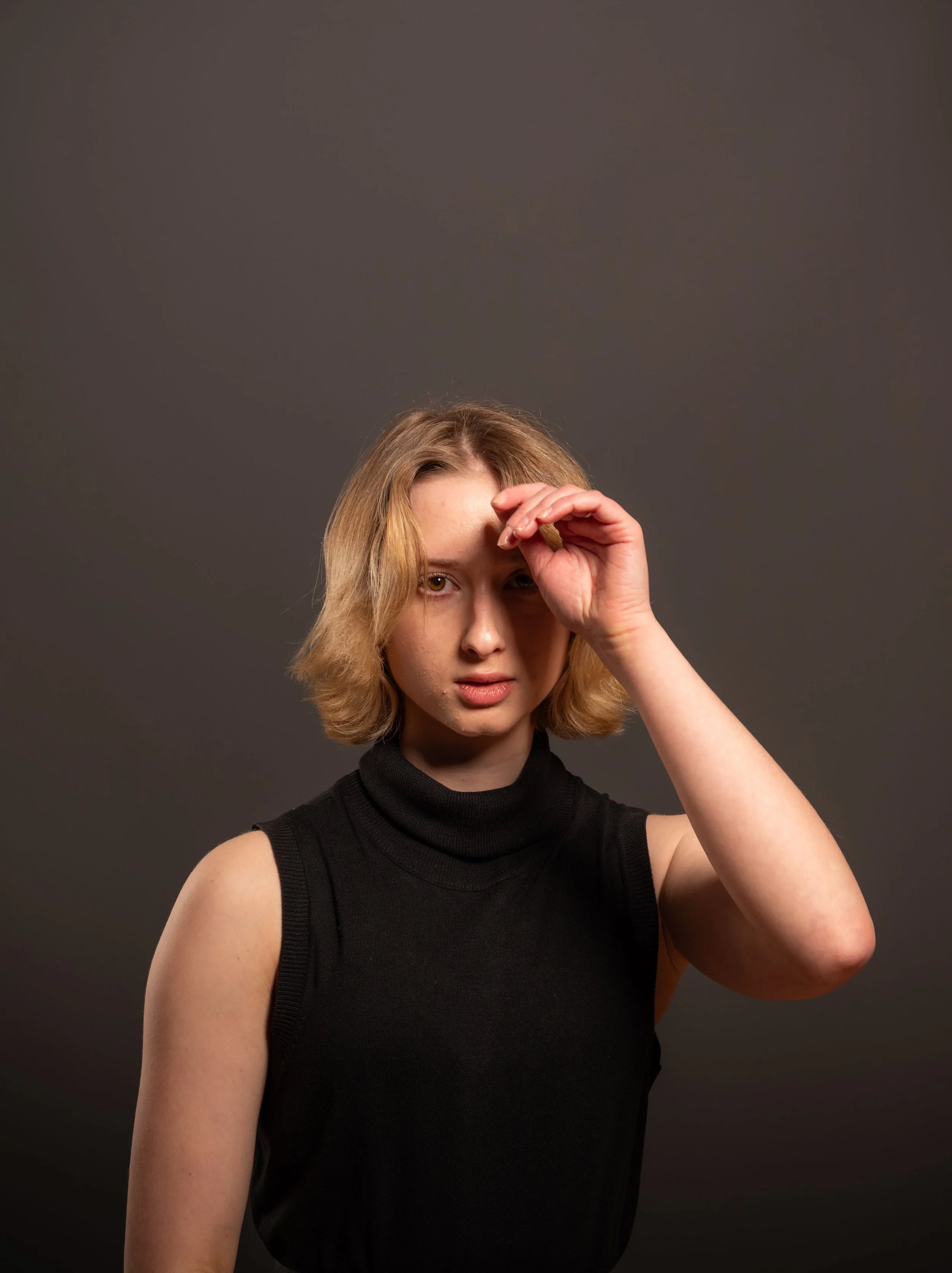 Studio-lit female headshot showing flattering portrait lighting for women