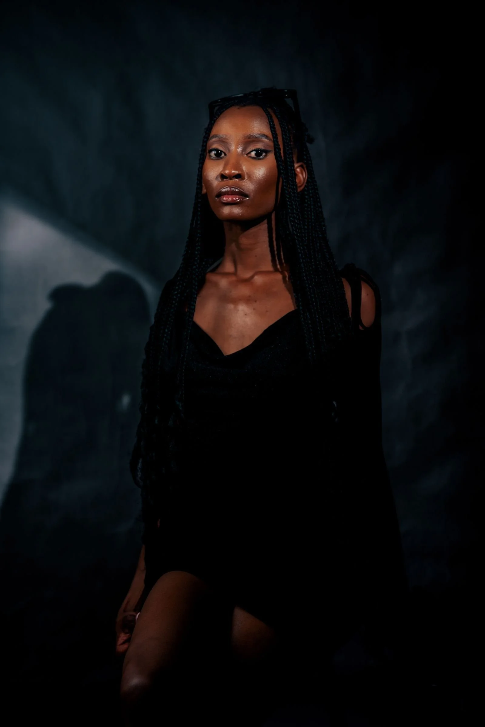 Dramatic studio portrait with sculpted shadows, the signature look of a beauty dish in the softbox vs umbrella debate