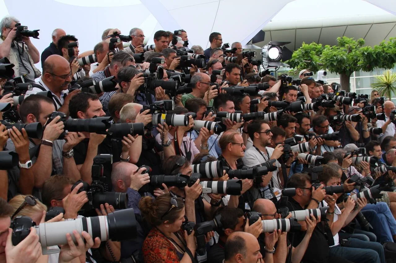 Press and media photographers covering a corporate conference