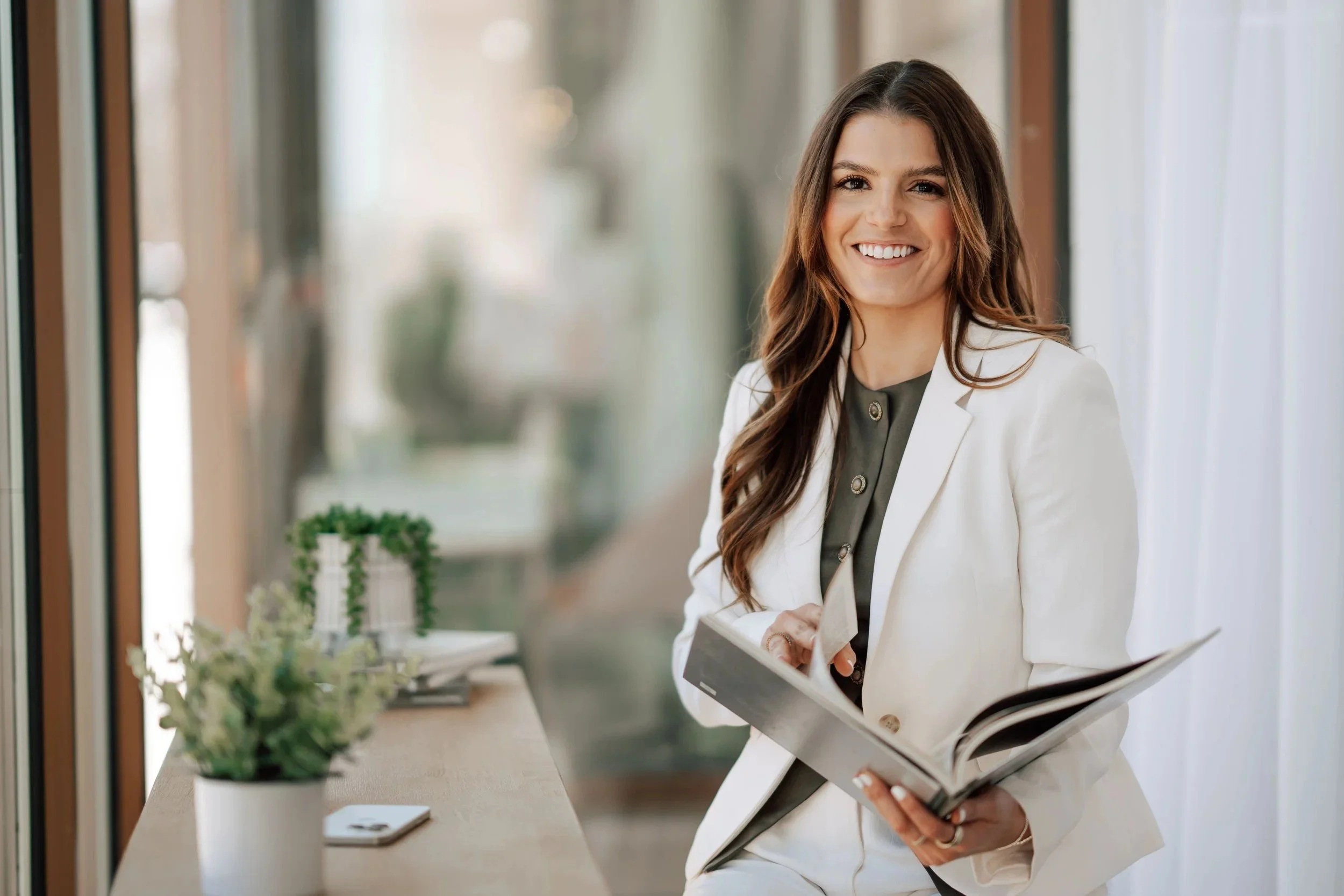 Woman preparing wardrobe choices for a personal branding photoshoot