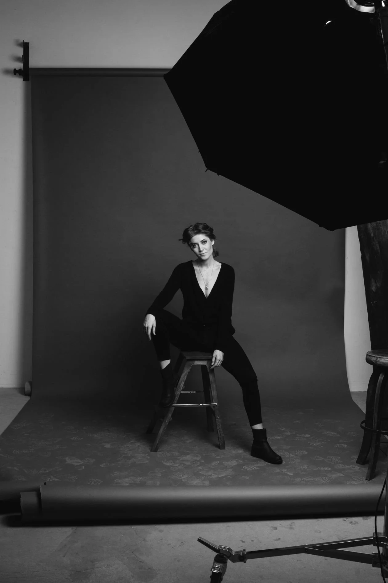 Black and white studio portrait setup with softbox lighting for commercial photography