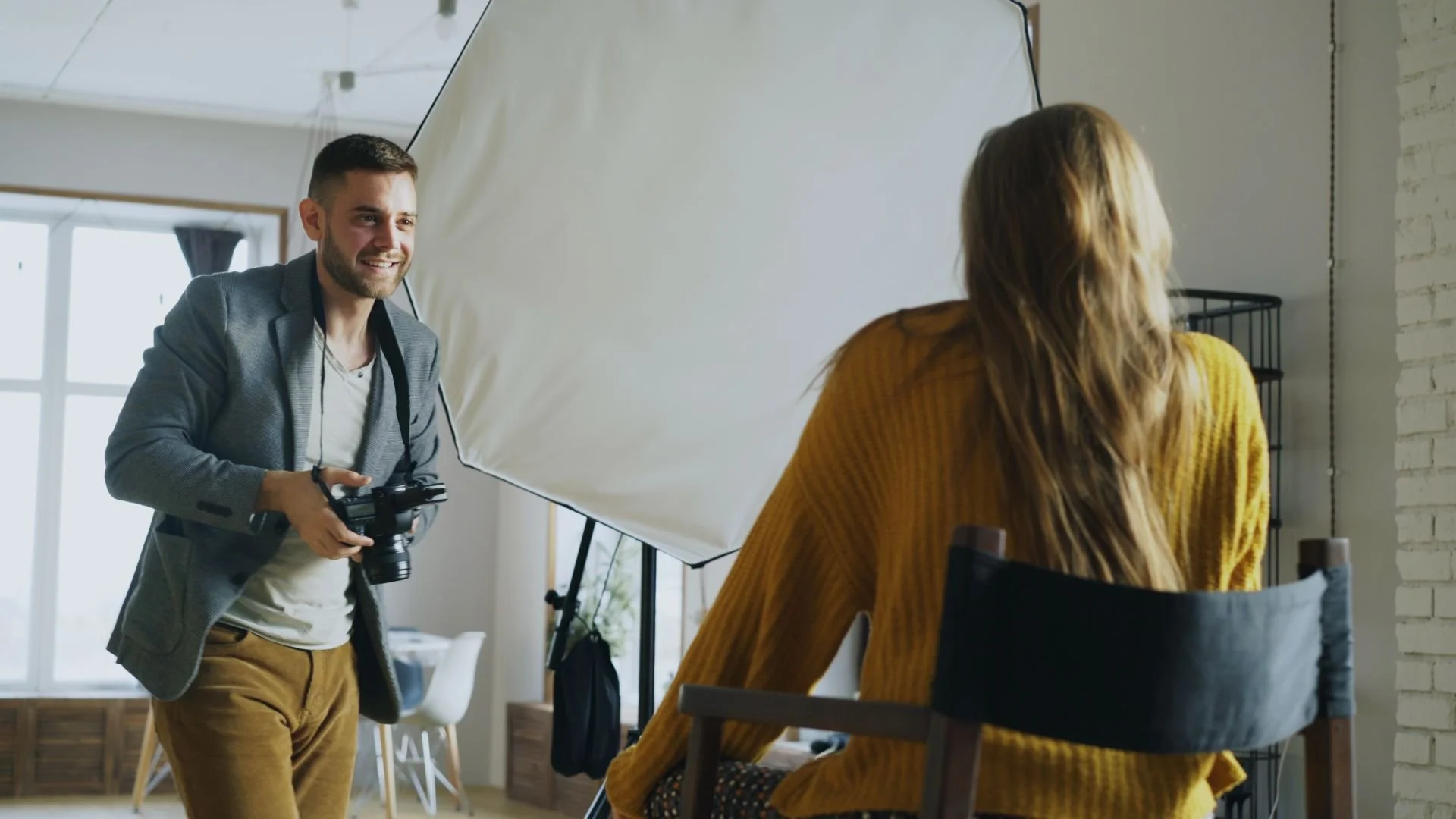Los Angeles photoshoot in progress: photographer capturing a model under studio lighting