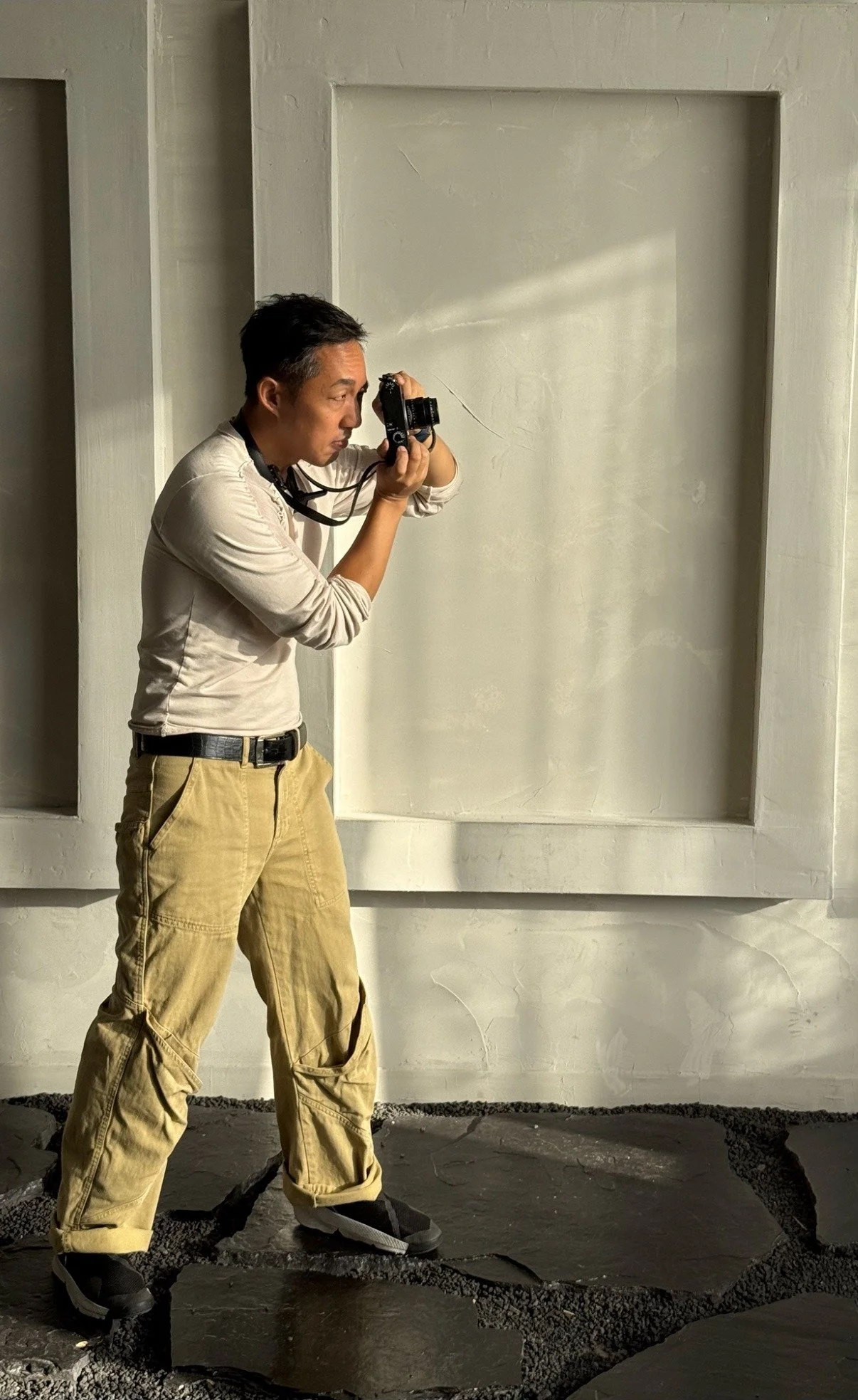 Photographer David Christopher Lee shooting on location with his camera