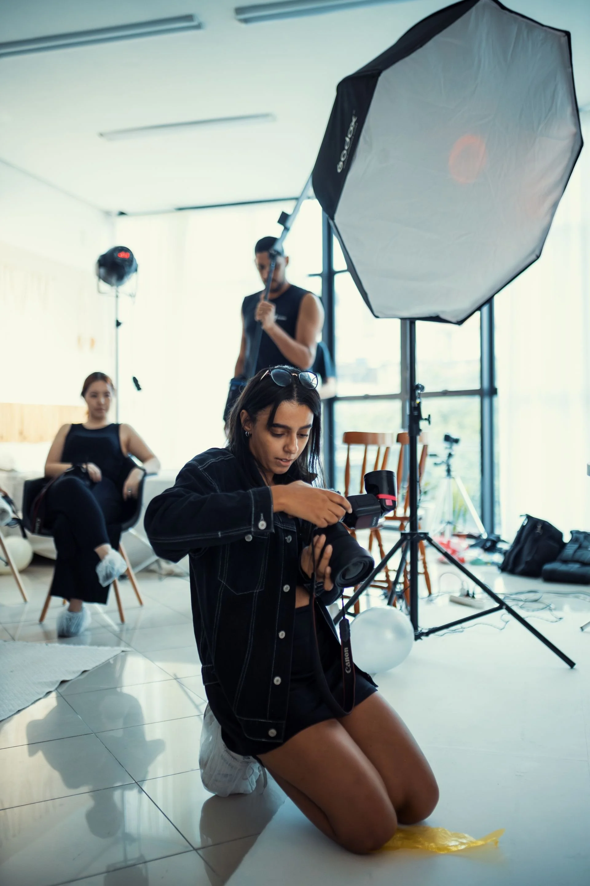 Behind the scenes of a professional photoshoot in a modern Los Angeles studio