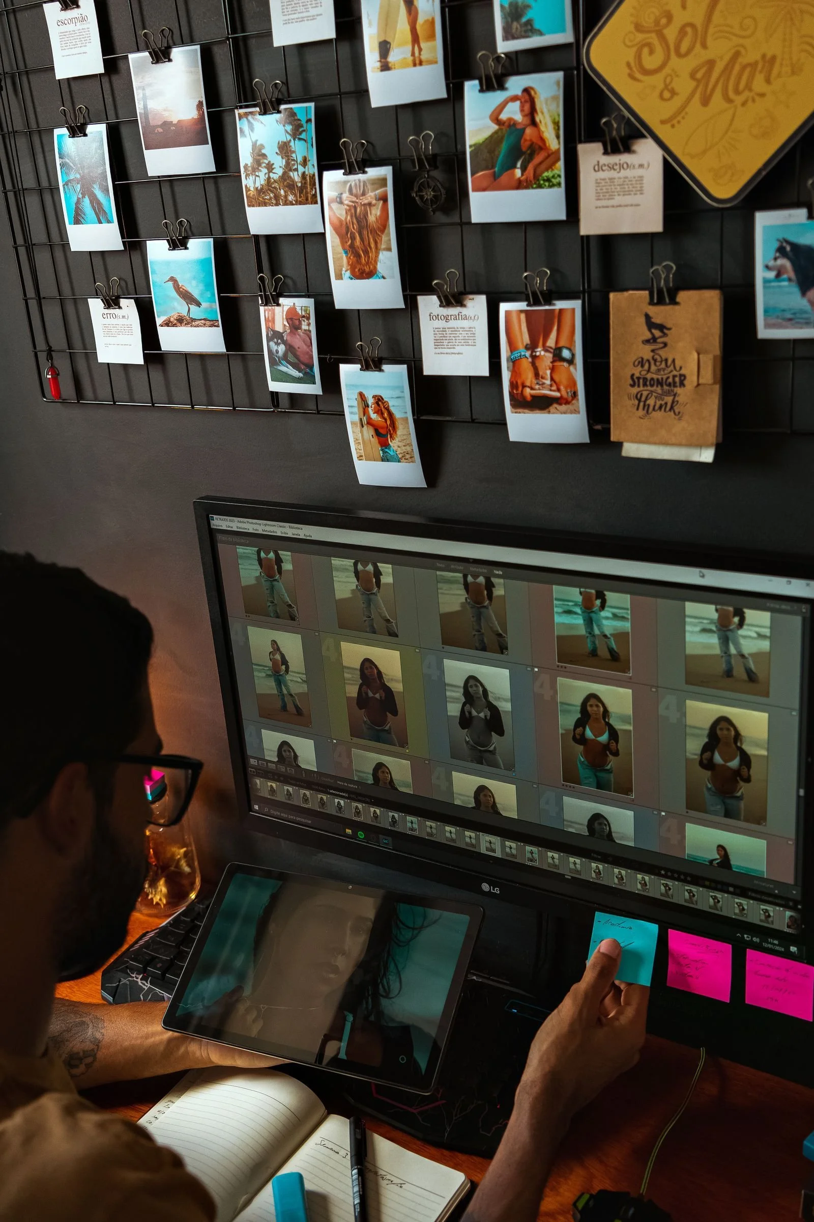 Photographer editing portraits on a computer monitor, Capture One vs Lightroom color workflow