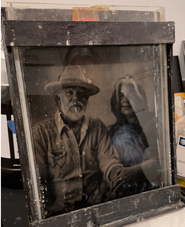 A tintype in the fix bath in the darkroom of Blake Wylie in Franklin, TN
